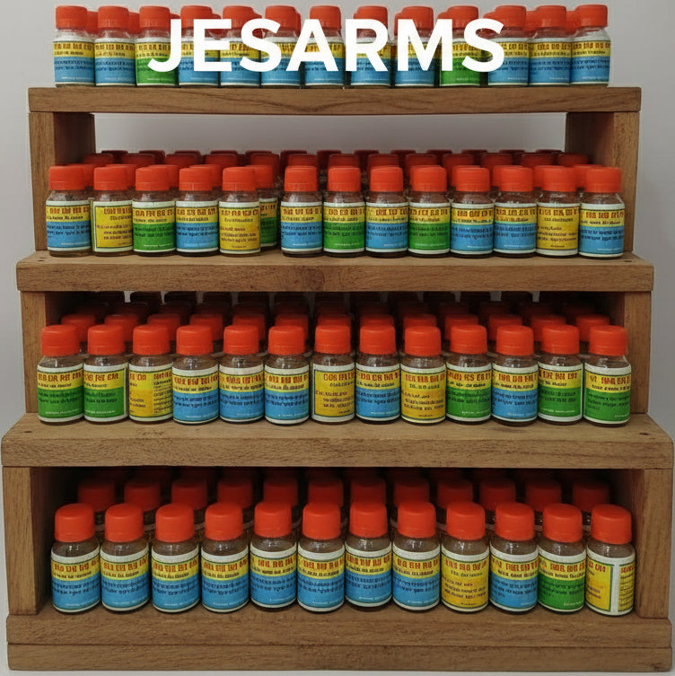 Three small bottles with red caps on a white surface, with a sign in the background that reads 'JESUS SAVES'.