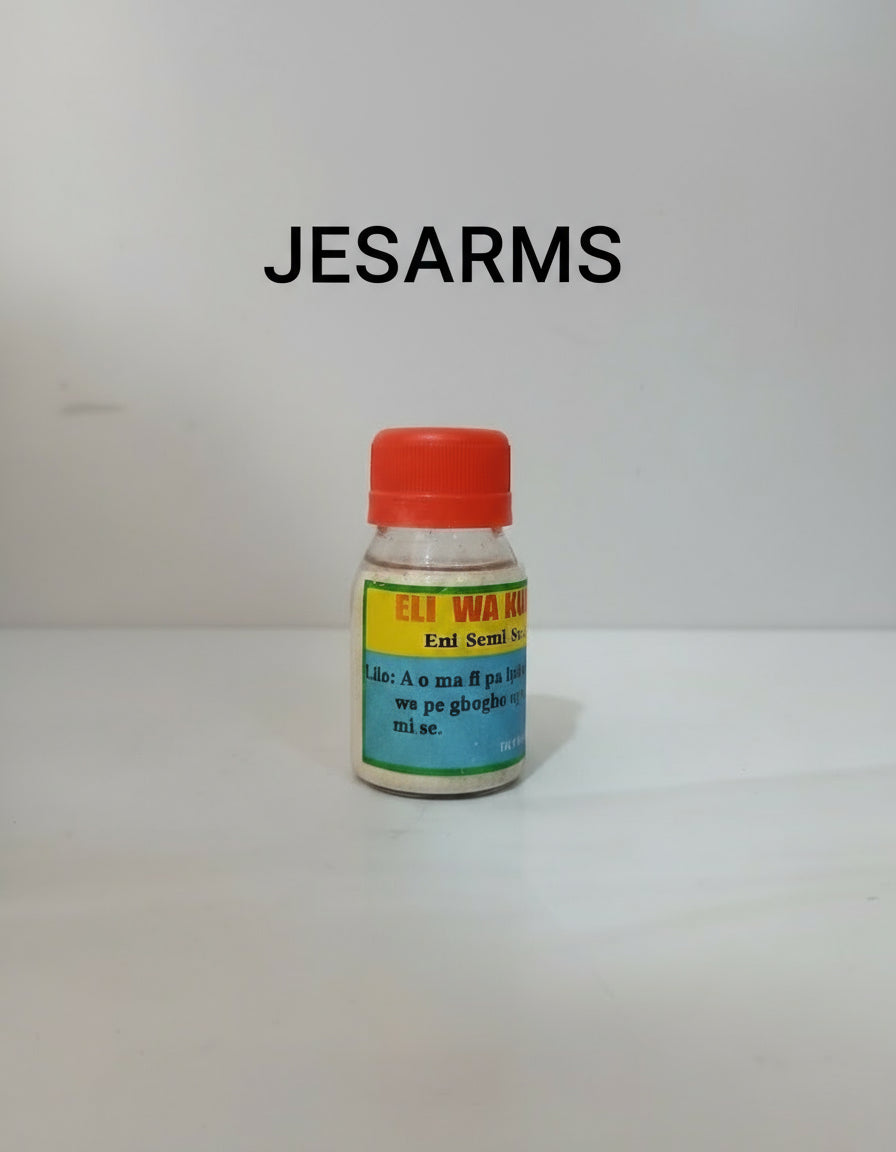 Small bottle with a red cap on a white surface, with 'Jesus Saves' sign in the background.